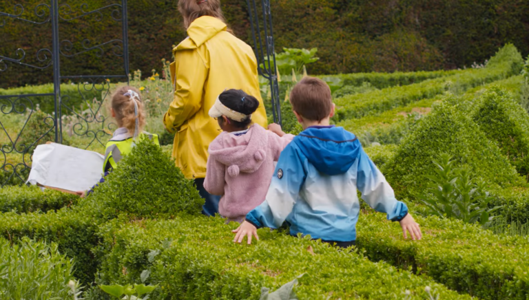 Children walking through the Bishop's garden.