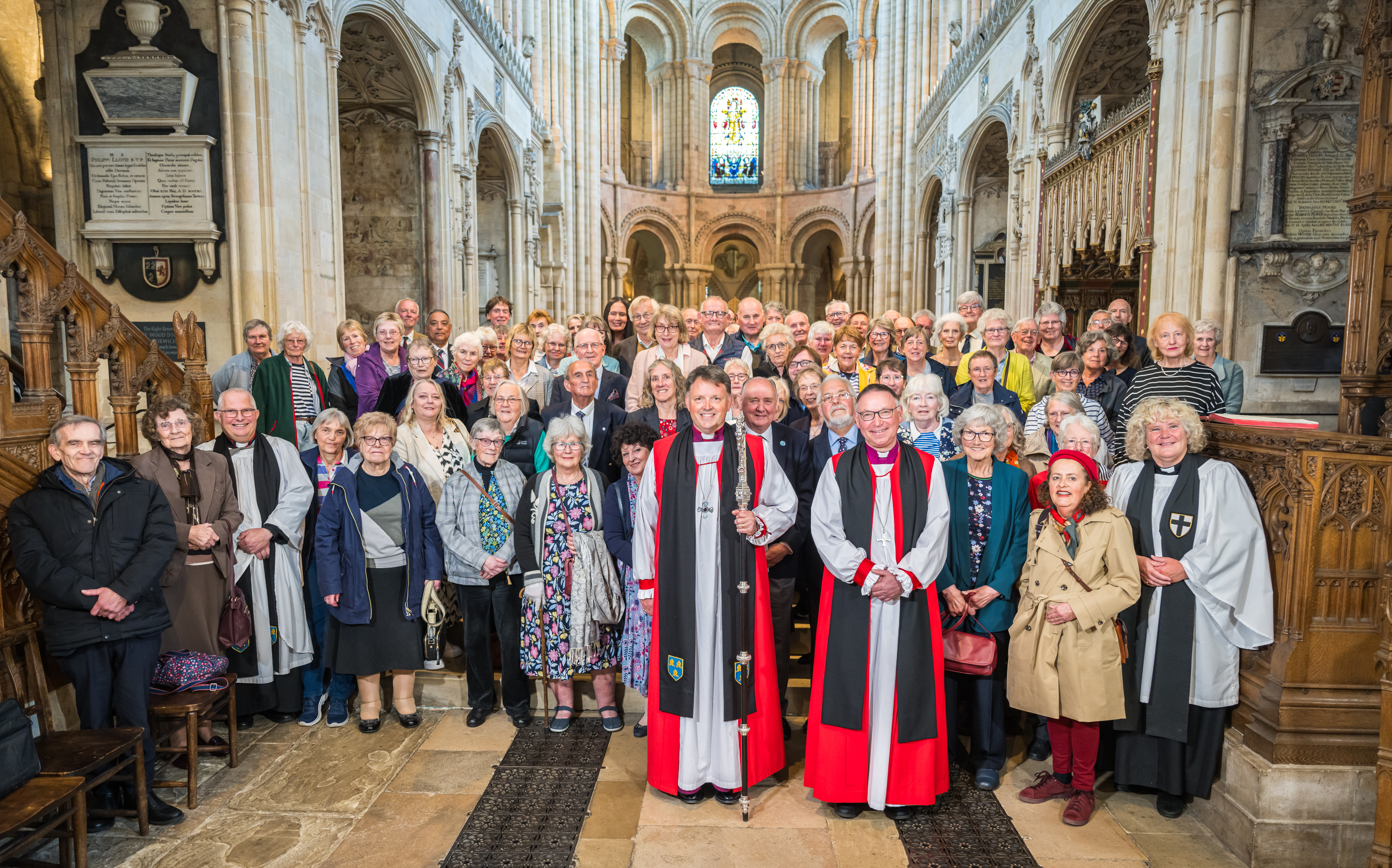 A group photo of the Churchwardens inside Norwich Cathedral